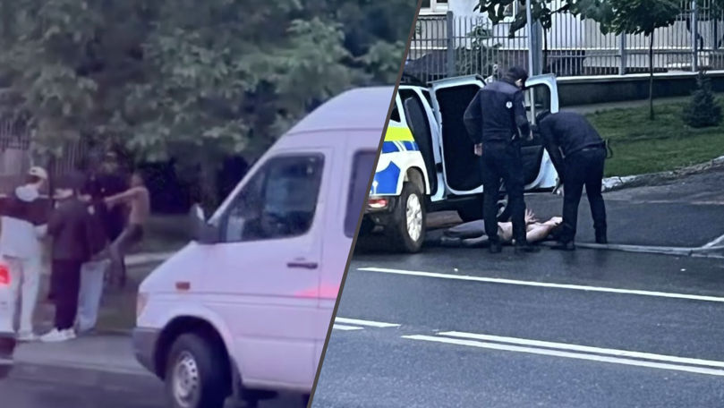 Reținere cu „dificultăți” la Buiucani: Un bărbat, suit cu greu în mașina Poliției
