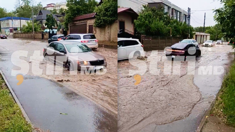Șuvoaie de apă pe străzile din Chișinău. Mașinile circulă cu dificultate